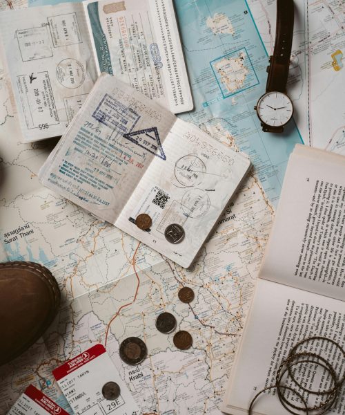 Explore wanderlust with flatlay of passport, map, and travel essentials.