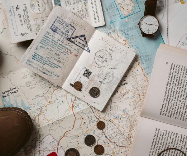 Explore wanderlust with flatlay of passport, map, and travel essentials.